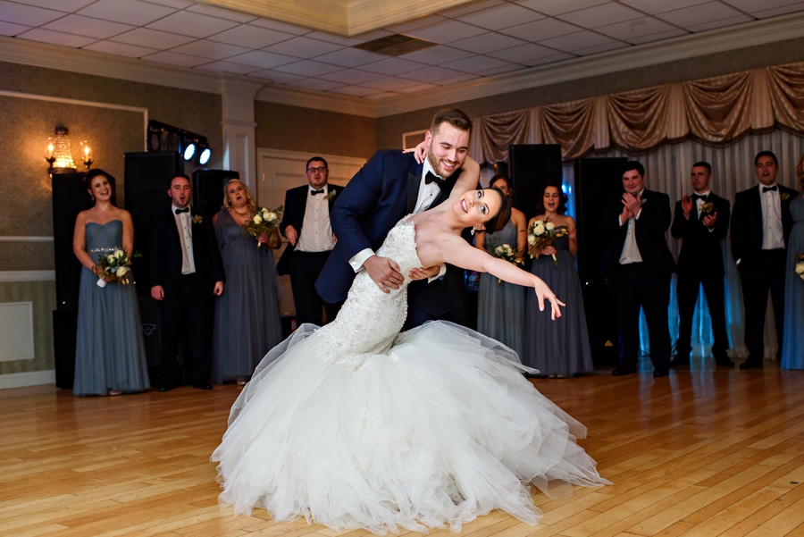 A married couple dance thier first dance.